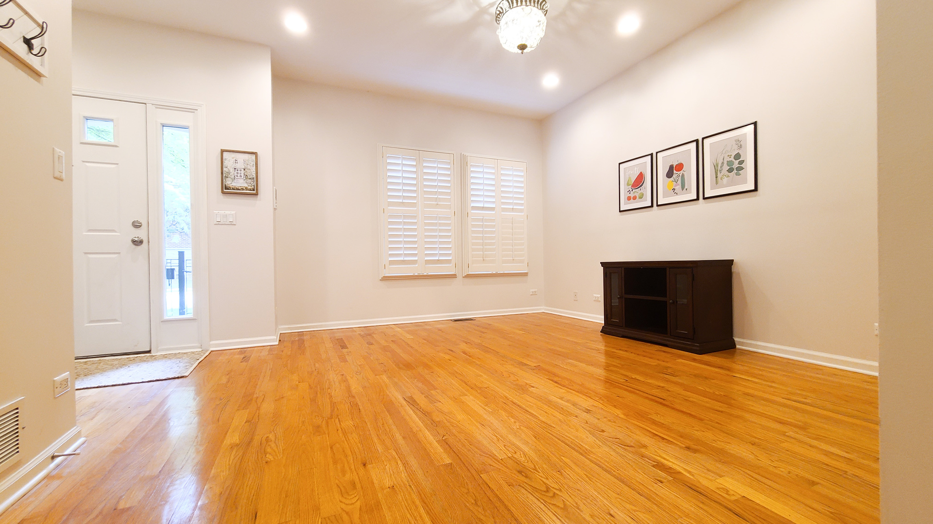 352 West Seminary Avenue, Unit 504 Wheaton, IL 60187 - Photo 5 of 24 a view of an empty room with wooden floor and a window
