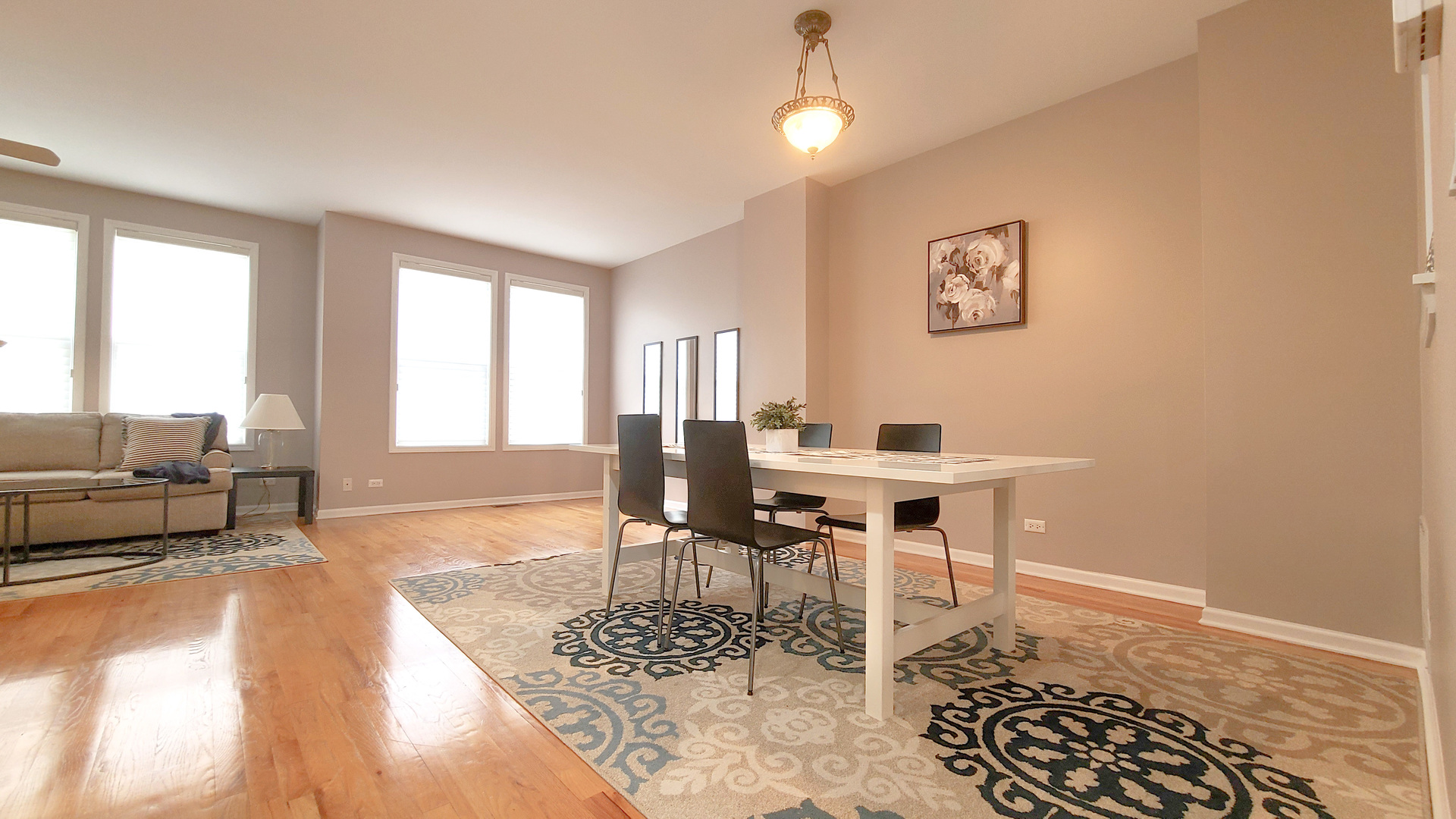 352 West Seminary Avenue, Unit 504 Wheaton, IL 60187 - Photo 9 of 24 a living room with furniture a dining table and a piano table with wooden floor