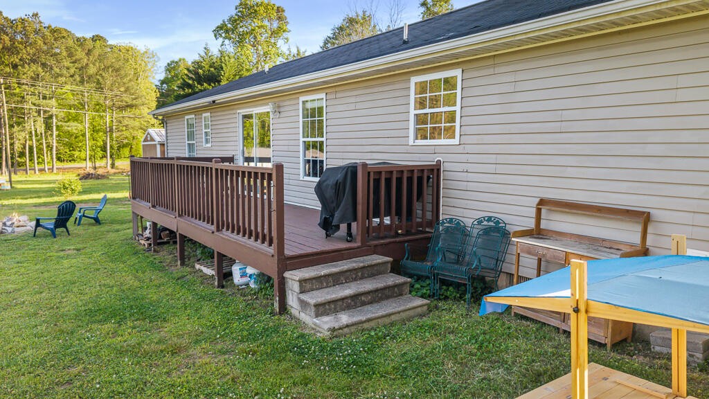 2850 Lower River Road Northwest Georgetown, TN 37336 - Photo 27 of 38 a view of a house with backyard and a garden