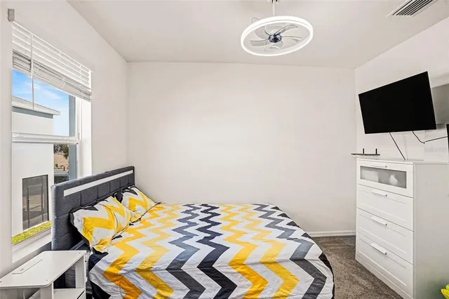 a bedroom with a bed and furniture