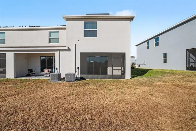 a view of a house with a yard and garage