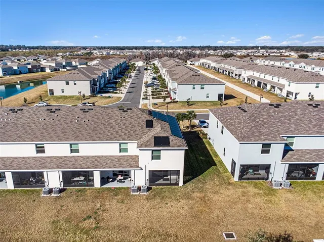 an aerial view of a house with a ocean view
