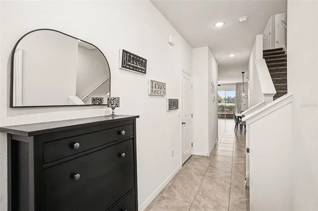 a view of a hallway with paintings on the wall