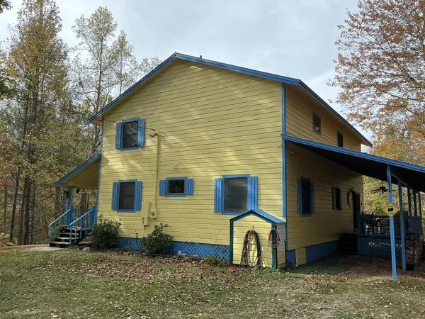 a view of a house with a yard