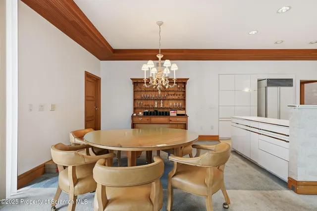 a kitchen with a sink and a stove with wooden floor