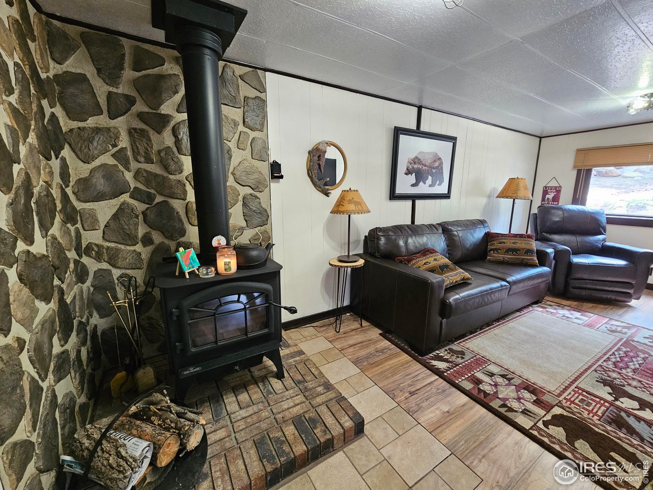 265 Onawa Road Red Feather Lakes, CO 80545 - Photo 6 of 15 With a wood burning fireplace