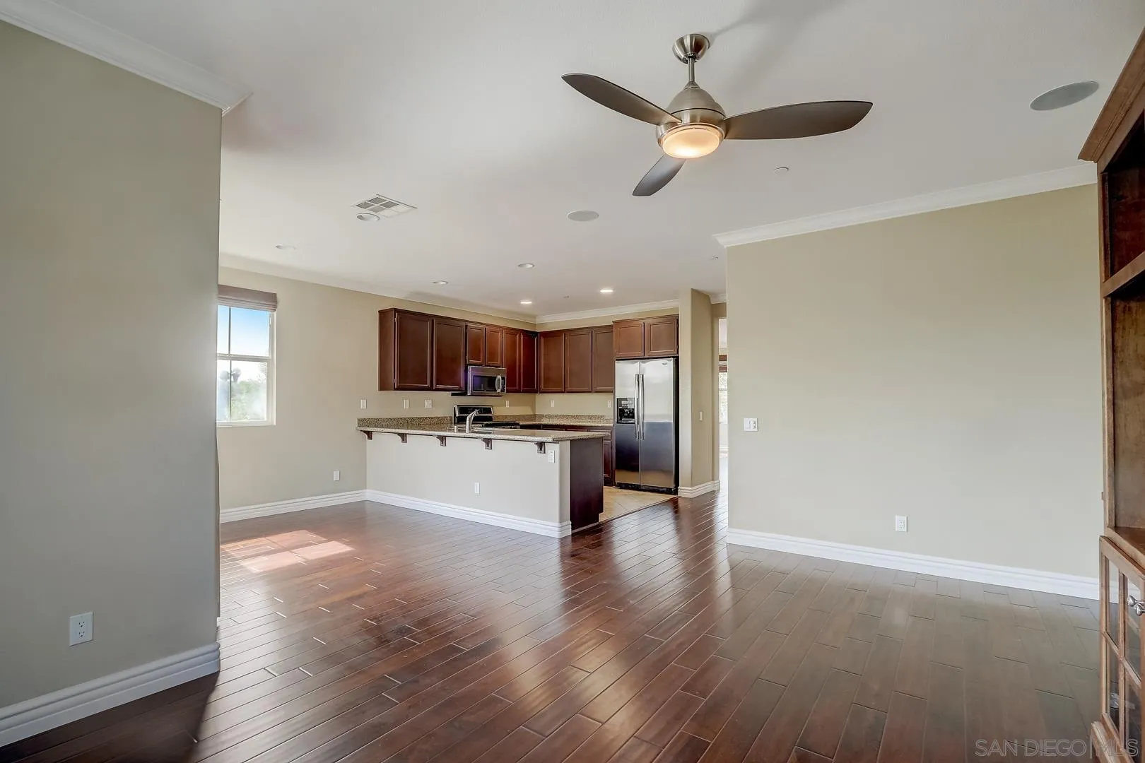 10185 Leavesly Trail Santee, CA 92071 - Photo 15 of 27 a kitchen with stainless steel appliances kitchen island microwave and cabinets