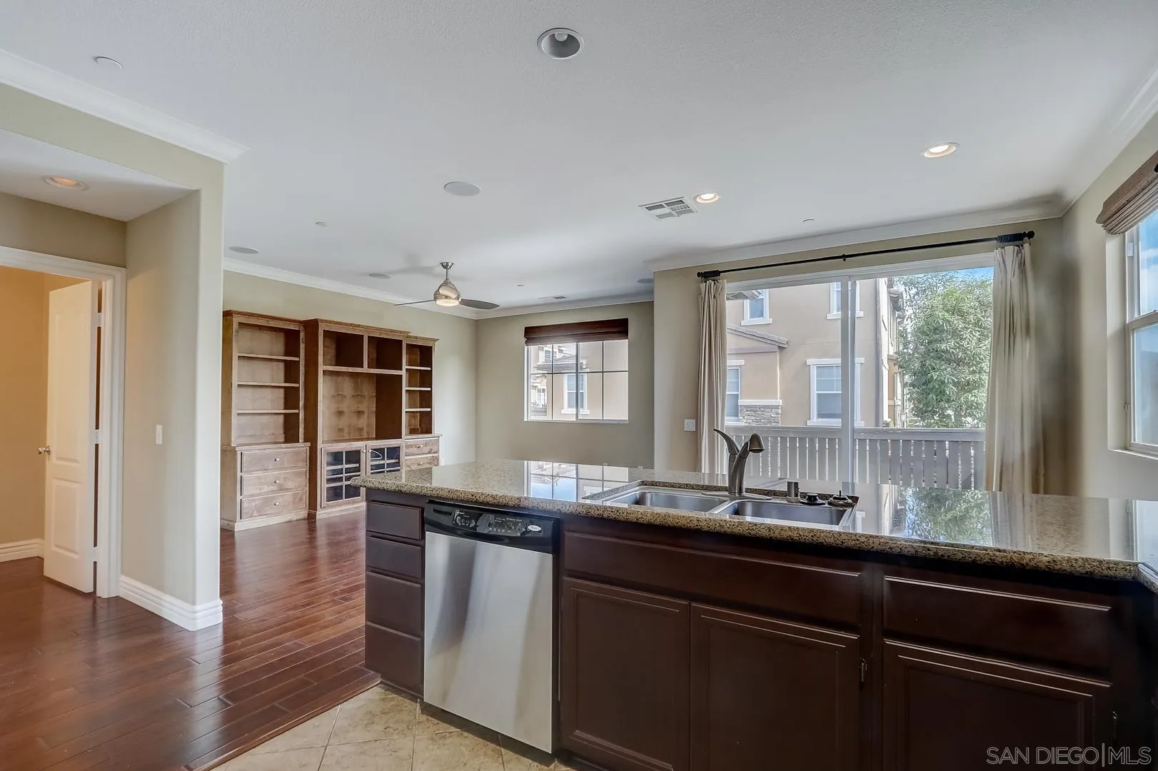 10185 Leavesly Trail Santee, CA 92071 - Photo 19 of 27 a kitchen with granite countertop a sink and a window