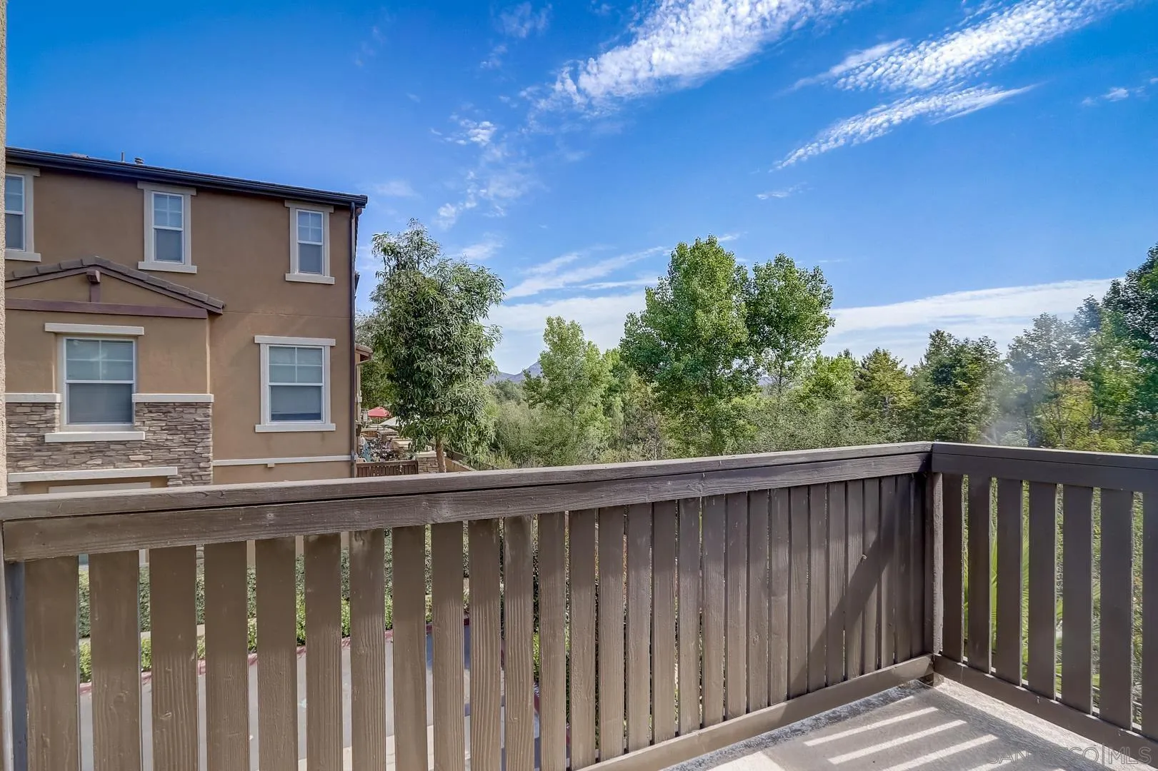 10185 Leavesly Trail Santee, CA 92071 - Photo 20 of 27 a wooden fence with trees in the background
