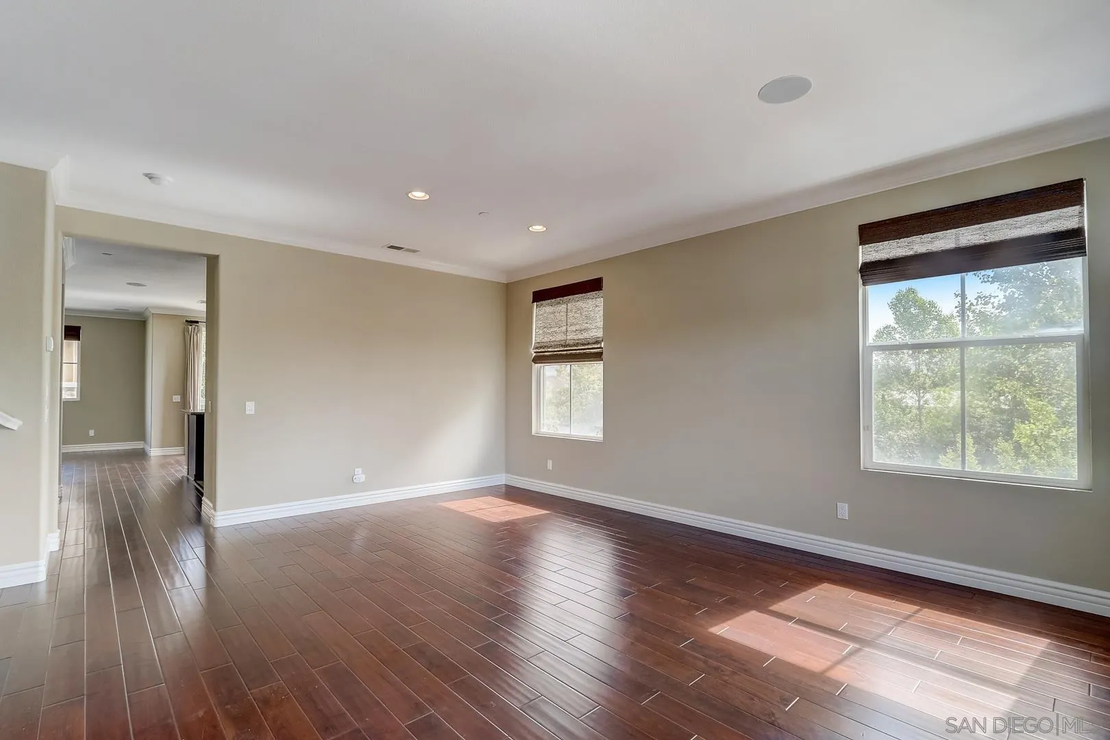 10185 Leavesly Trail Santee, CA 92071 - Photo 21 of 27 a view of an empty room with wooden floor and a window