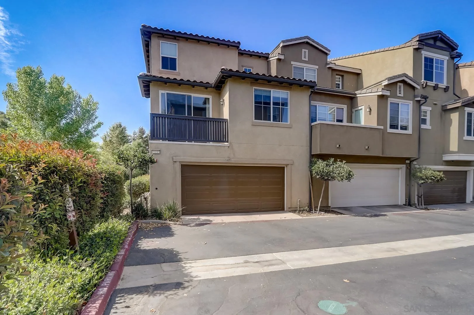 10185 Leavesly Trail Santee, CA 92071 - Photo 7 of 27 a front view of a house with a yard and garage