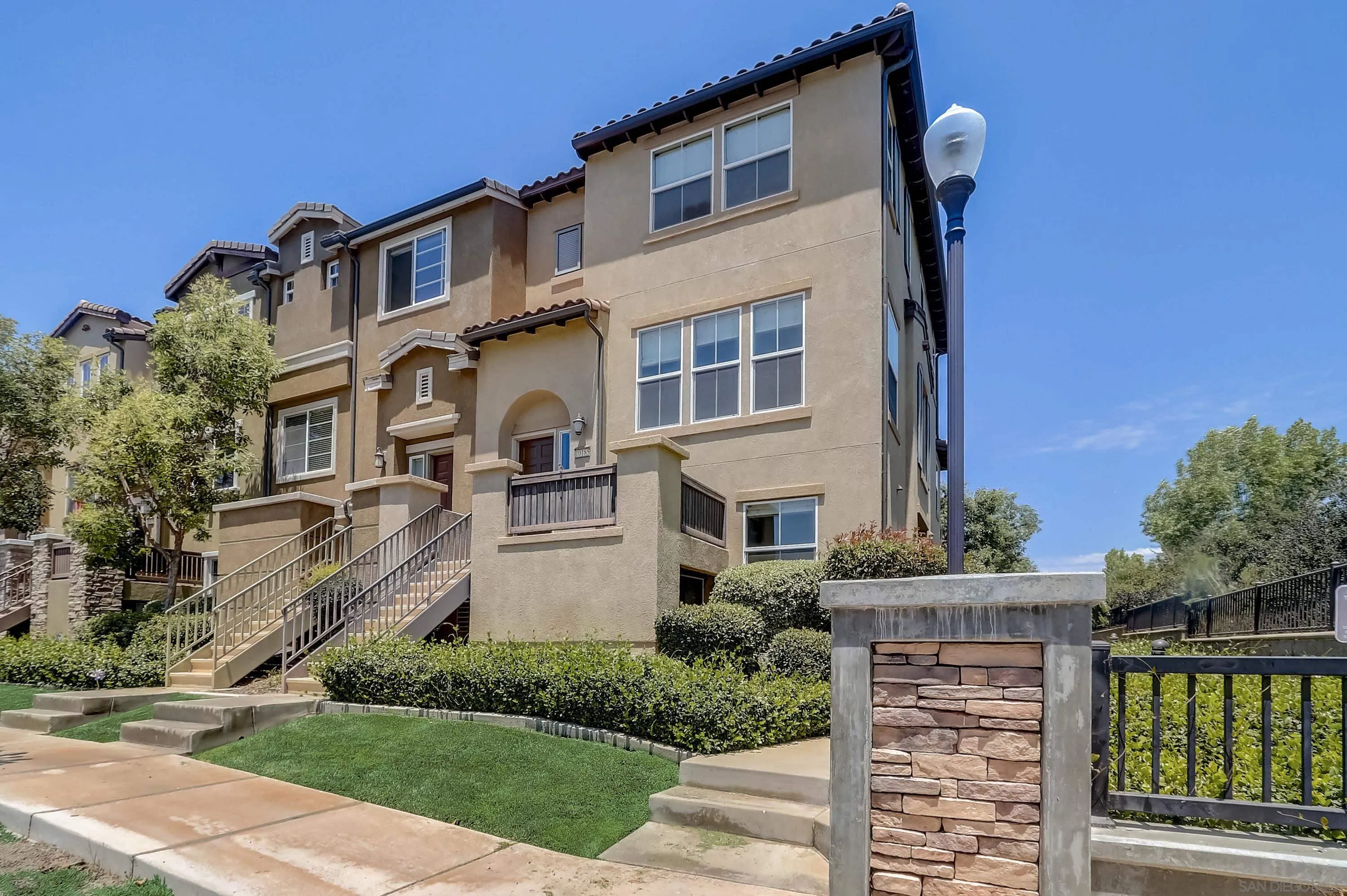 10185 Leavesly Trail Santee, CA 92071 - Photo 10 of 27 a front view of a house with a yard