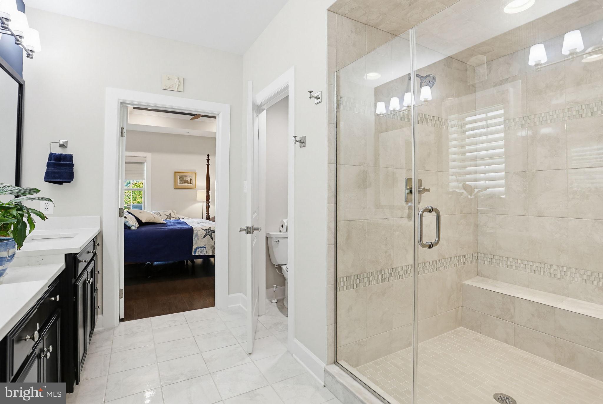 3816 Fulham Road Frederick, MD 21704 - Photo 21 of 77 a en suite spacious bathroom with a glass shower door and a mirror