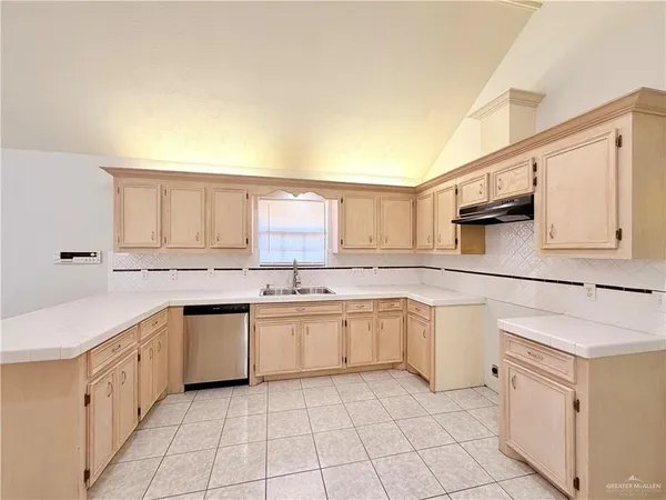 a kitchen with a sink and cabinets