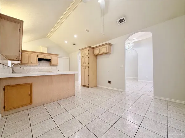a bathroom with a sink vanity and mirror