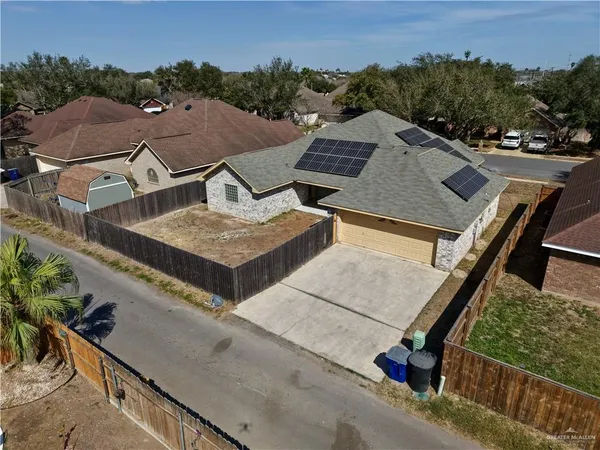 an aerial view of a house with a garden