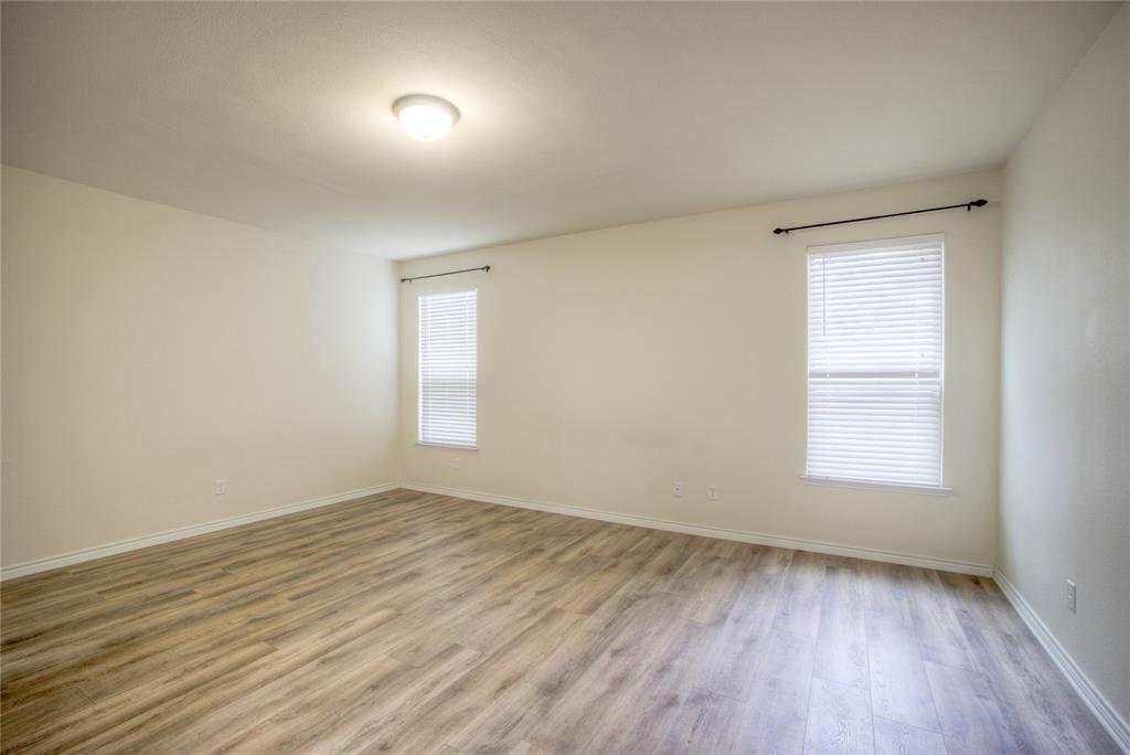 5633 Ridge Lake Drive Fort Worth, TX 76244 - Photo 10 of 23 Spare room featuring light wood finished floors and baseboards