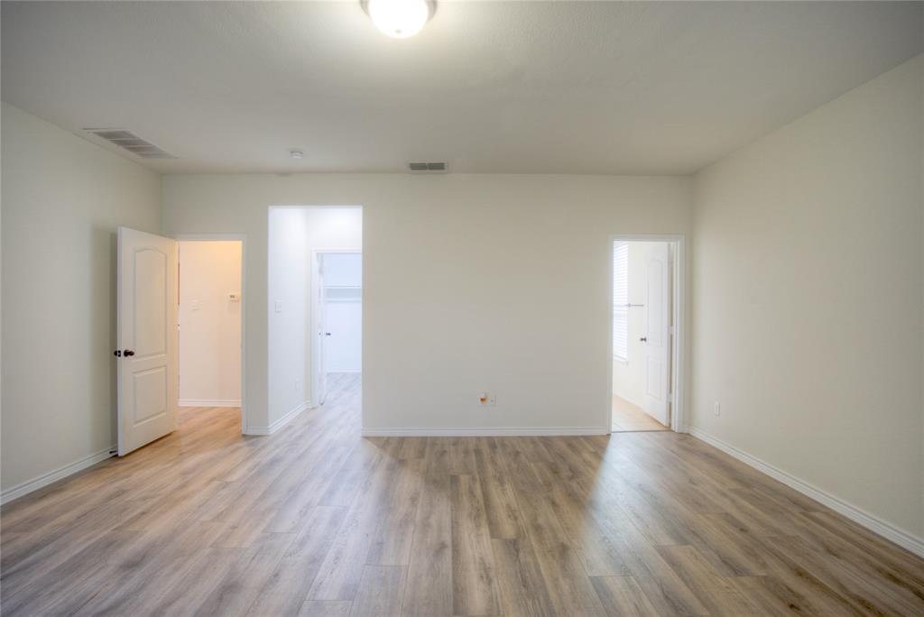 5633 Ridge Lake Drive Fort Worth, TX 76244 - Photo 12 of 23 Unfurnished room with light wood finished floors
