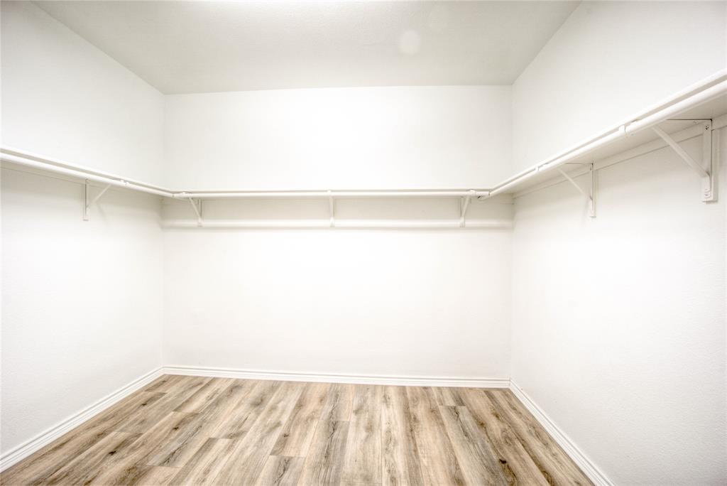 5633 Ridge Lake Drive Fort Worth, TX 76244 - Photo 13 of 23 Walk in closet featuring light wood-type flooring