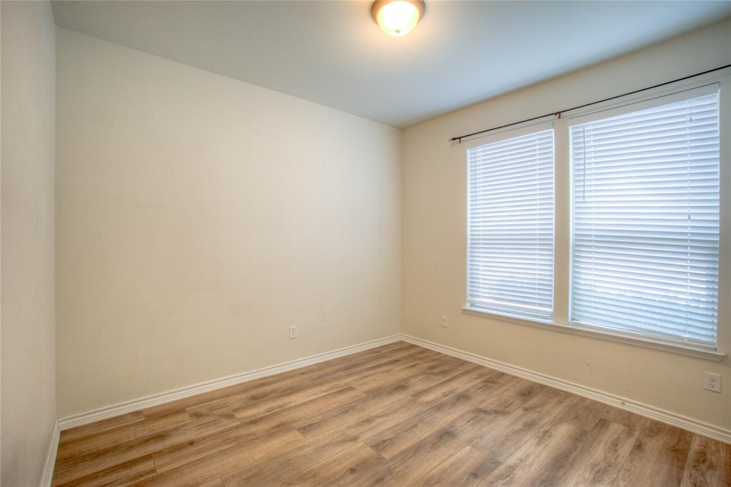 5633 Ridge Lake Drive Fort Worth, TX 76244 - Photo 16 of 23 Spare room featuring wood finished floors