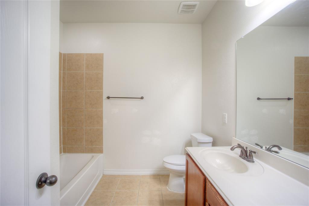 5633 Ridge Lake Drive Fort Worth, TX 76244 - Photo 17 of 23 Full bath with vanity and light tile patterned floors