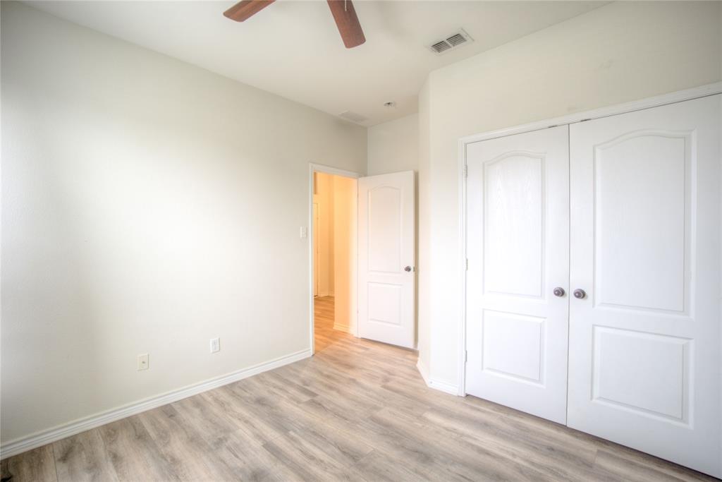 5633 Ridge Lake Drive Fort Worth, TX 76244 - Photo 18 of 23 Unfurnished bedroom with light wood finished floors, a closet, and ceiling fan