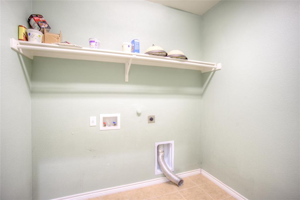 5633 Ridge Lake Drive Fort Worth, TX 76244 - Photo 19 of 23 Laundry room with hookup for a gas dryer, hookup for a washing machine, electric dryer hookup, and light tile patterned floors