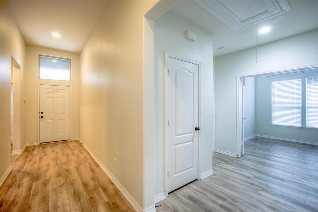 5633 Ridge Lake Drive Fort Worth, TX 76244 - Photo 2 of 23 Hallway with light wood-style floors and recessed lighting