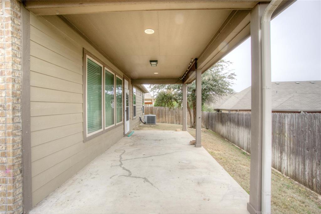 5633 Ridge Lake Drive Fort Worth, TX 76244 - Photo 21 of 23 Fenced backyard with a patio area