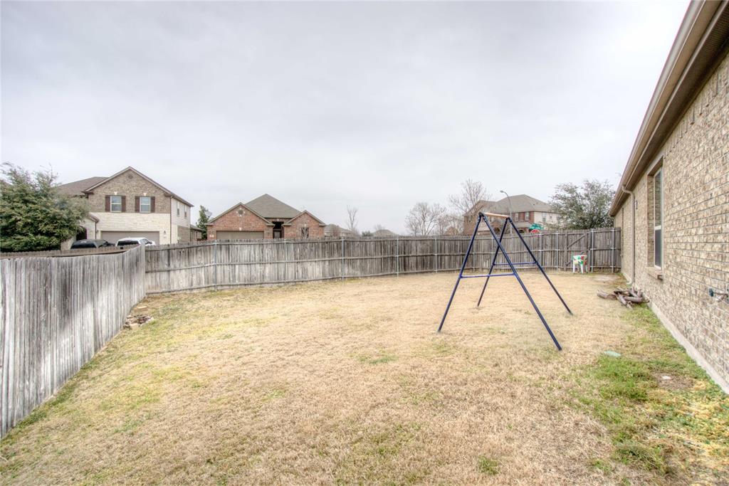 5633 Ridge Lake Drive Fort Worth, TX 76244 - Photo 22 of 23 Fenced backyard featuring a playground