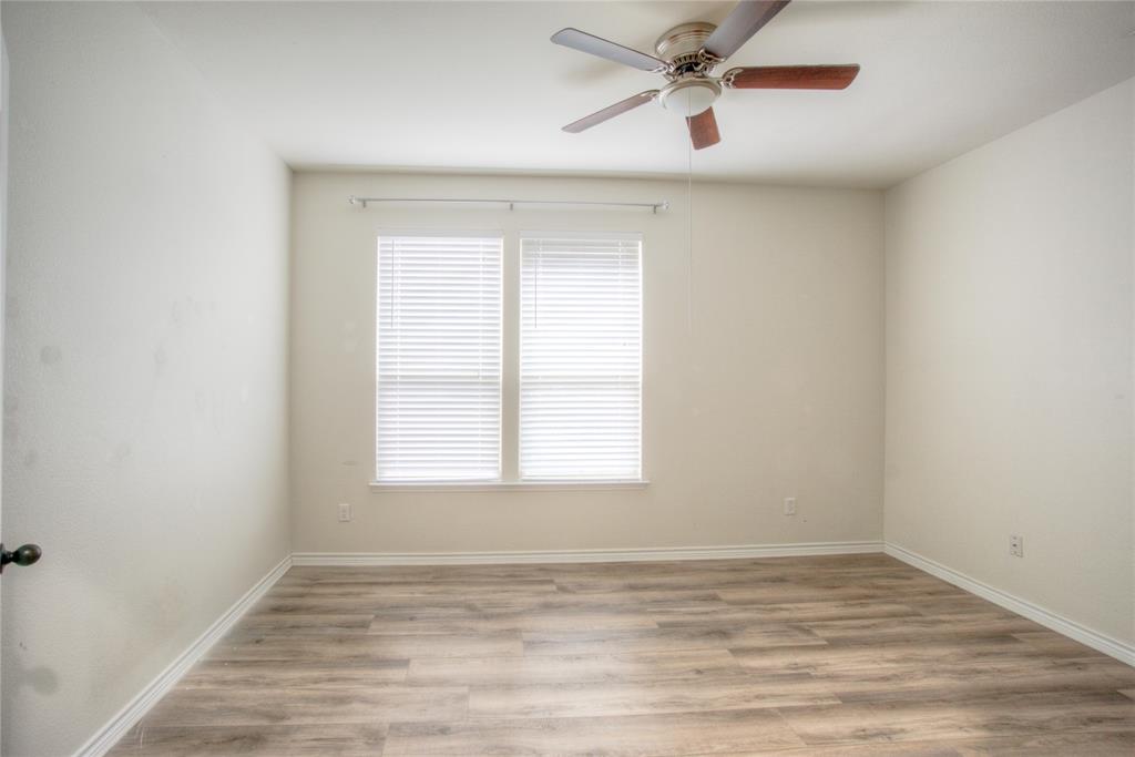 5633 Ridge Lake Drive Fort Worth, TX 76244 - Photo 3 of 23 Empty room with light wood-type flooring and ceiling fan