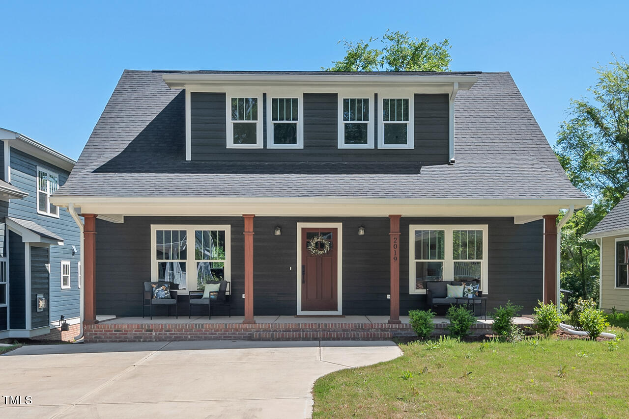 2019 James Street Durham, NC 27707 - Photo 1 of 46 a front view of brick house with a yard