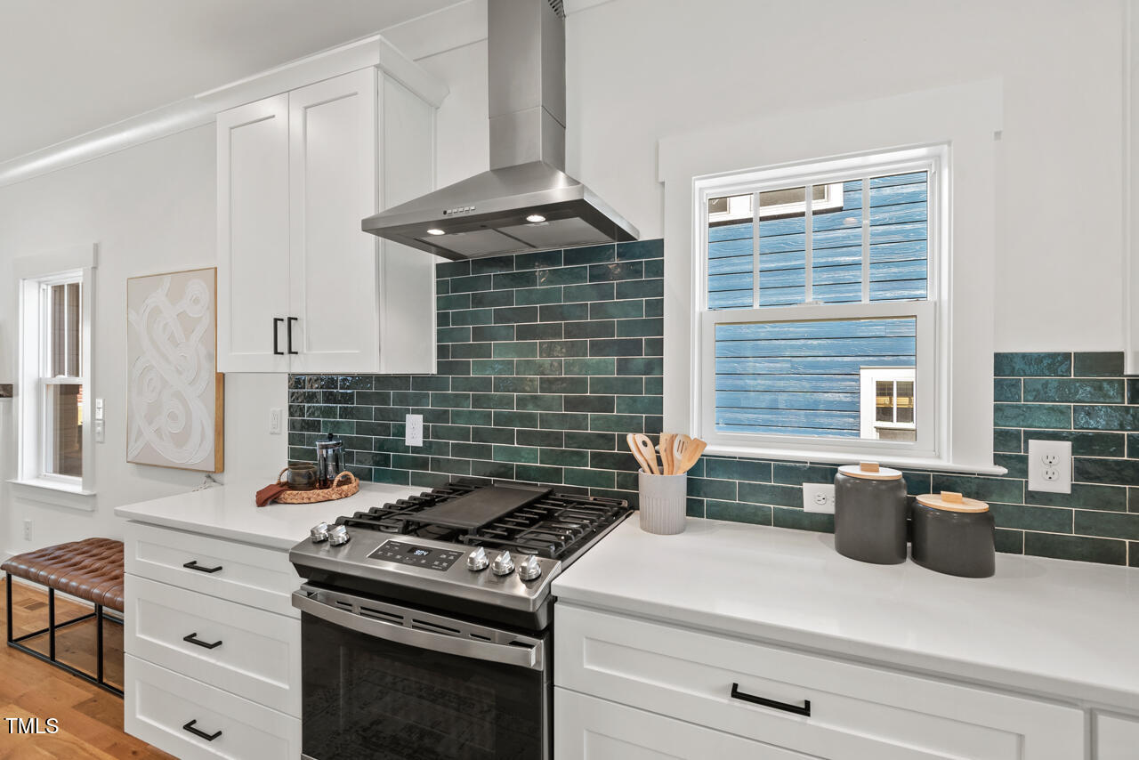 2019 James Street Durham, NC 27707 - Photo 11 of 46 a kitchen with granite countertop a stove and a sink