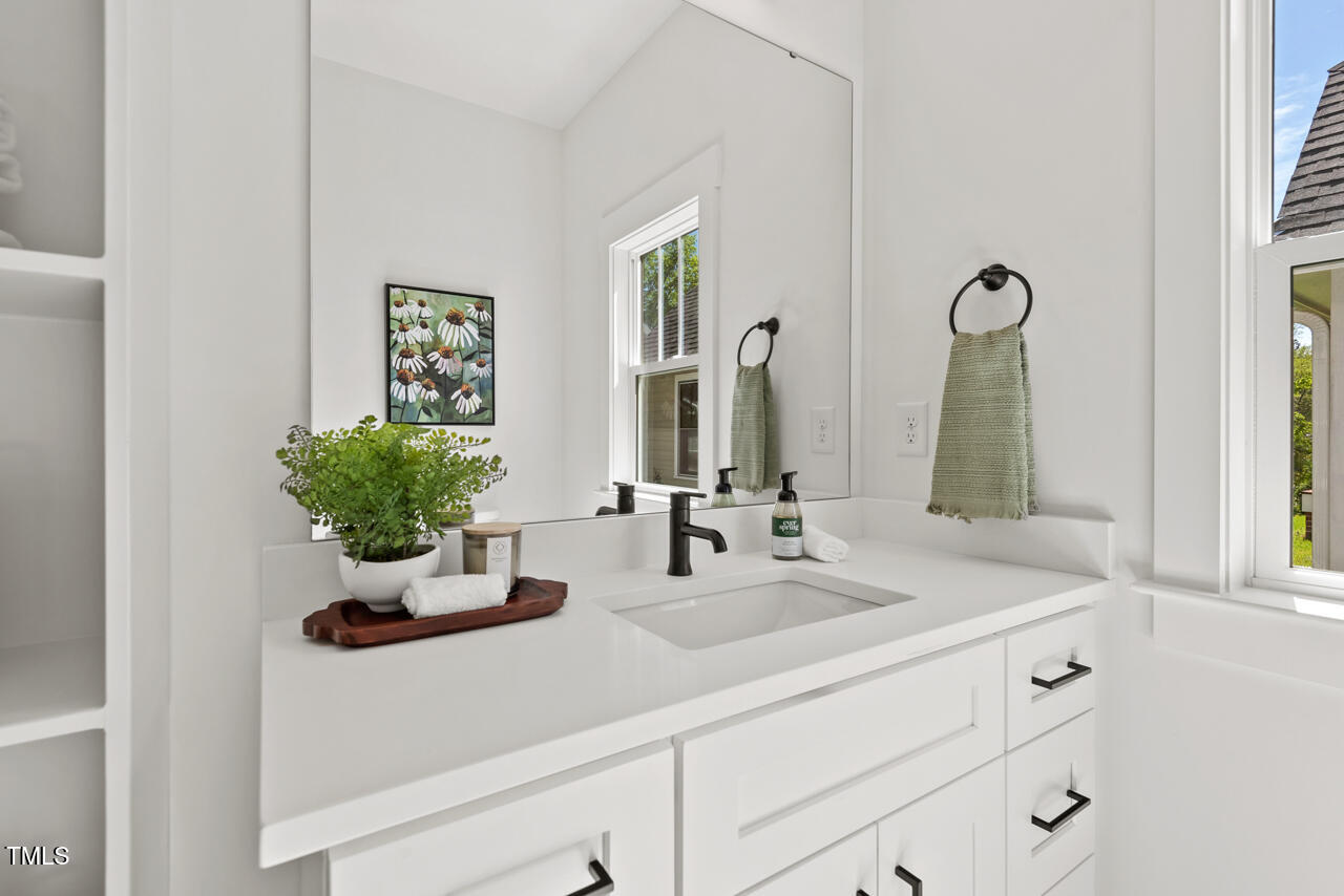 2019 James Street Durham, NC 27707 - Photo 18 of 46 a bathroom with sink and mirror