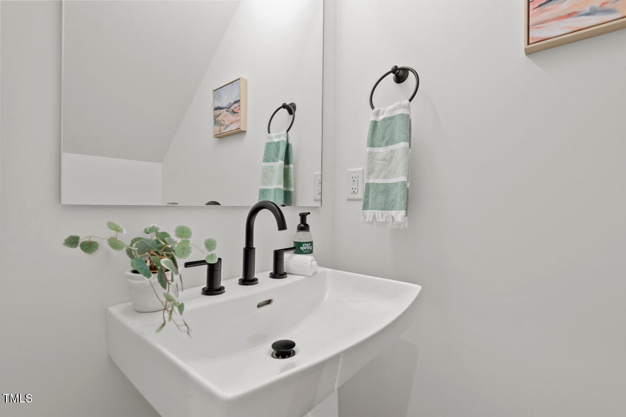 2019 James Street Durham, NC 27707 - Photo 20 of 46 a bathroom with a sink and a mirror