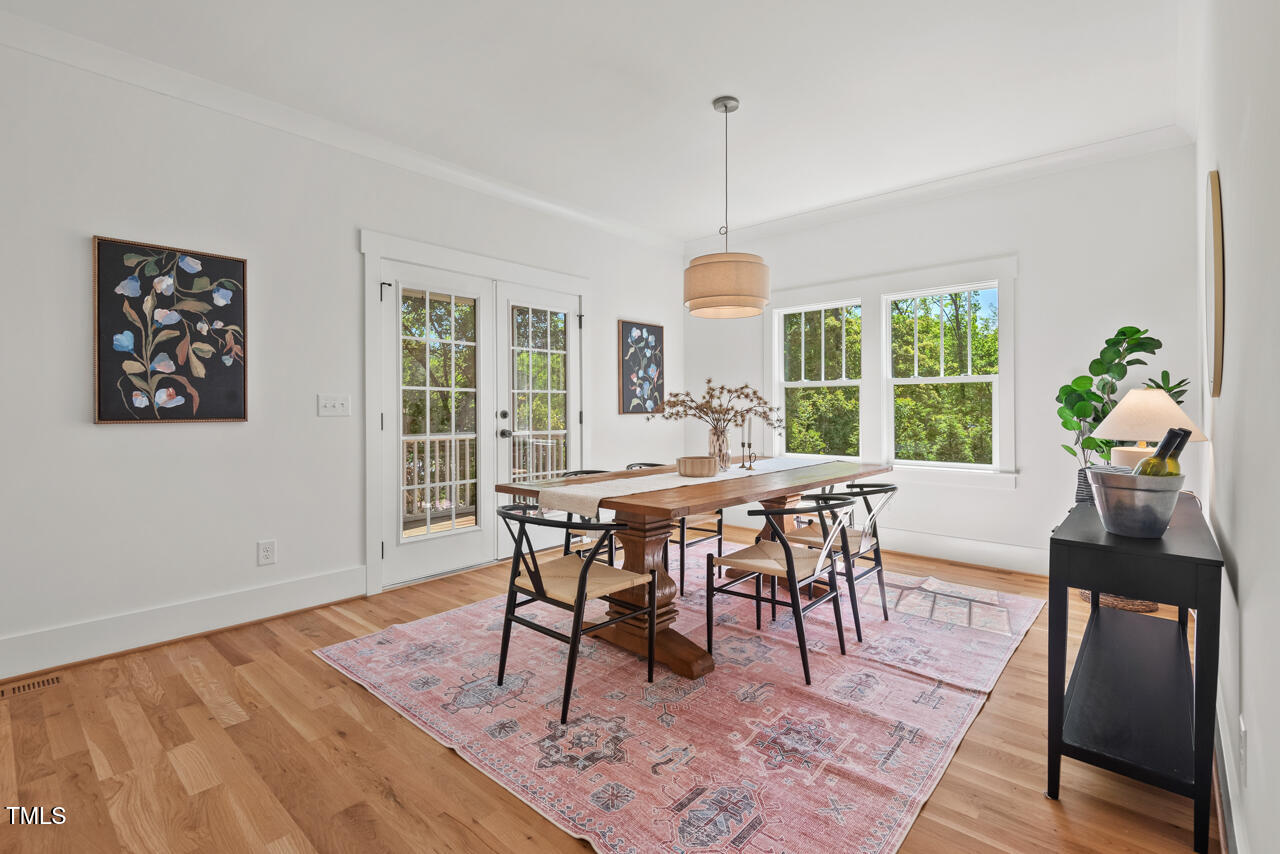 2019 James Street Durham, NC 27707 - Photo 21 of 46 a view of a dining room with furniture window and wooden floor