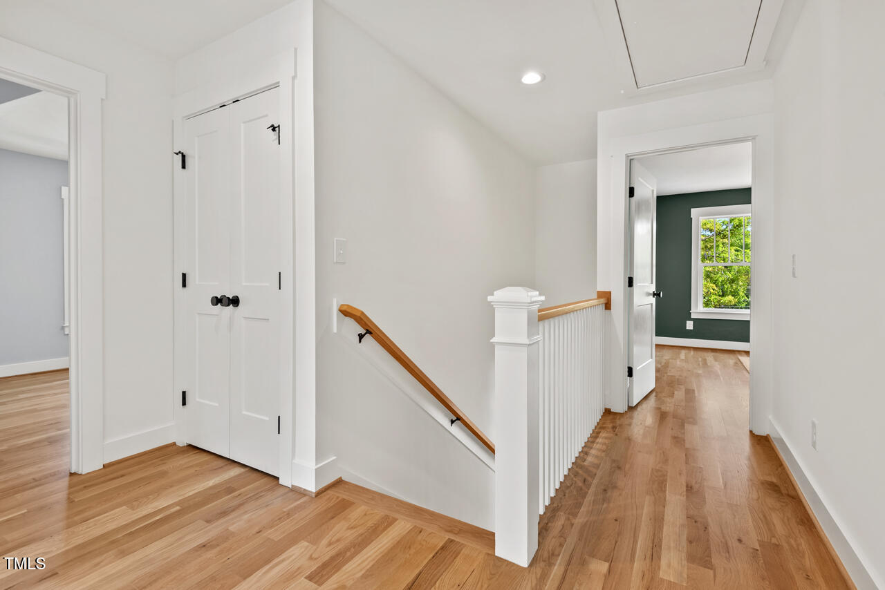 2019 James Street Durham, NC 27707 - Photo 29 of 46 a view of a hallway with wooden floor and staircase