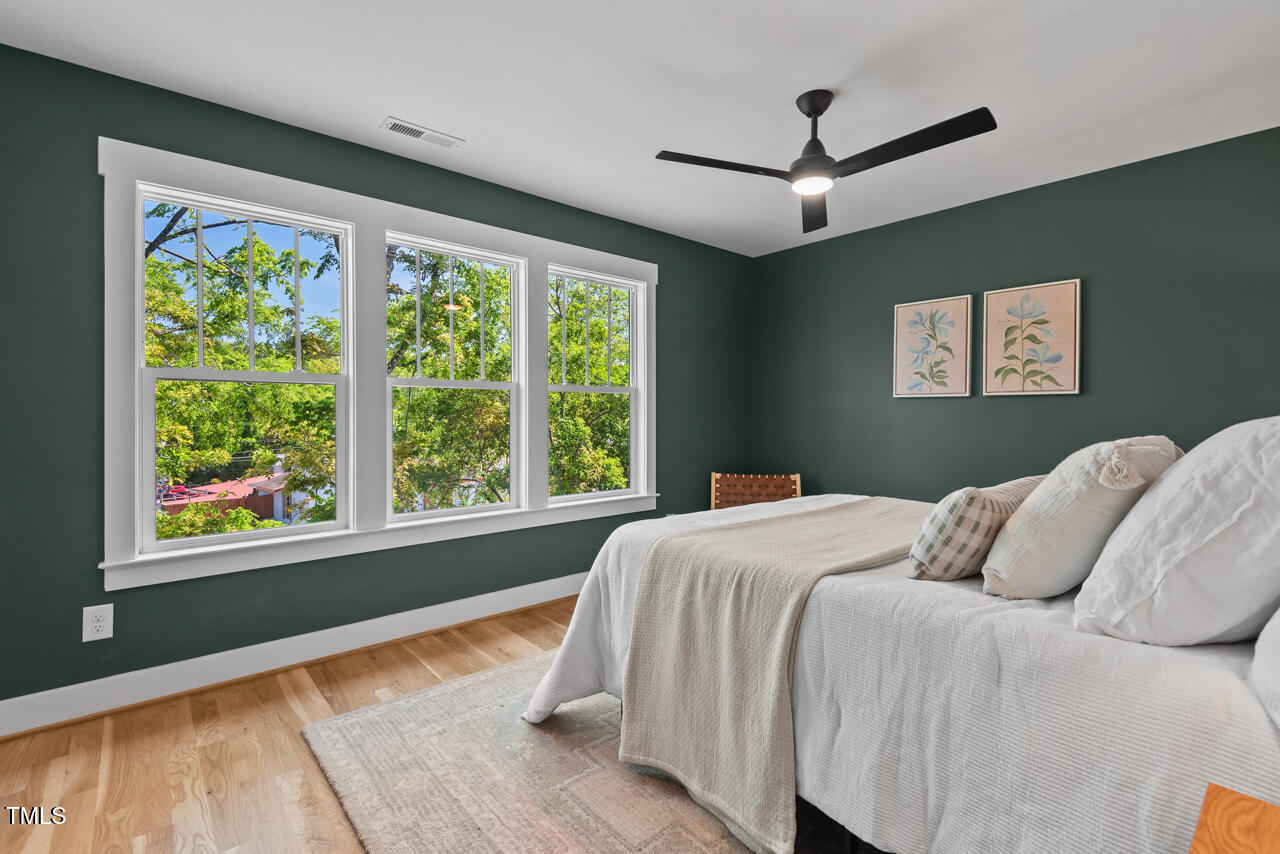 2019 James Street Durham, NC 27707 - Photo 30 of 46 a bedroom with a large bed and a large window