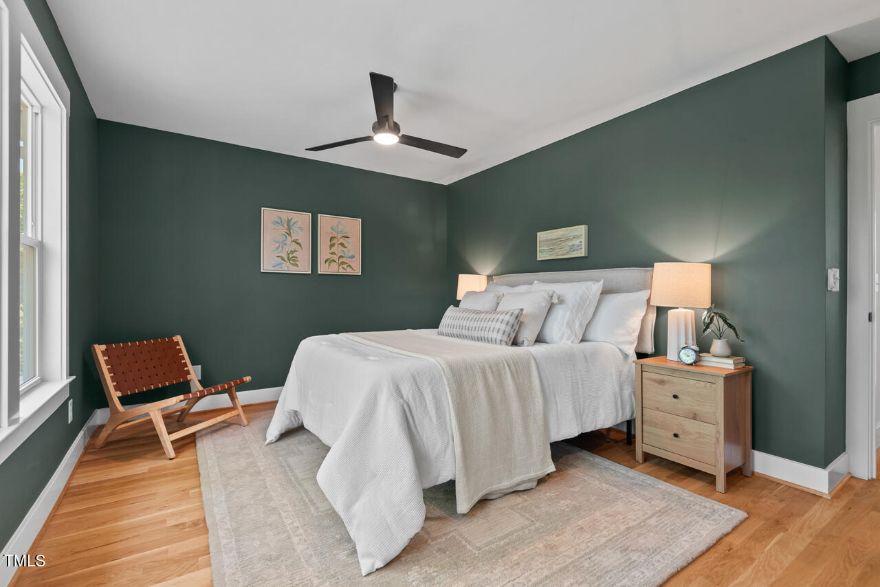 2019 James Street Durham, NC 27707 - Photo 31 of 46 a bedroom with a bed and a chair