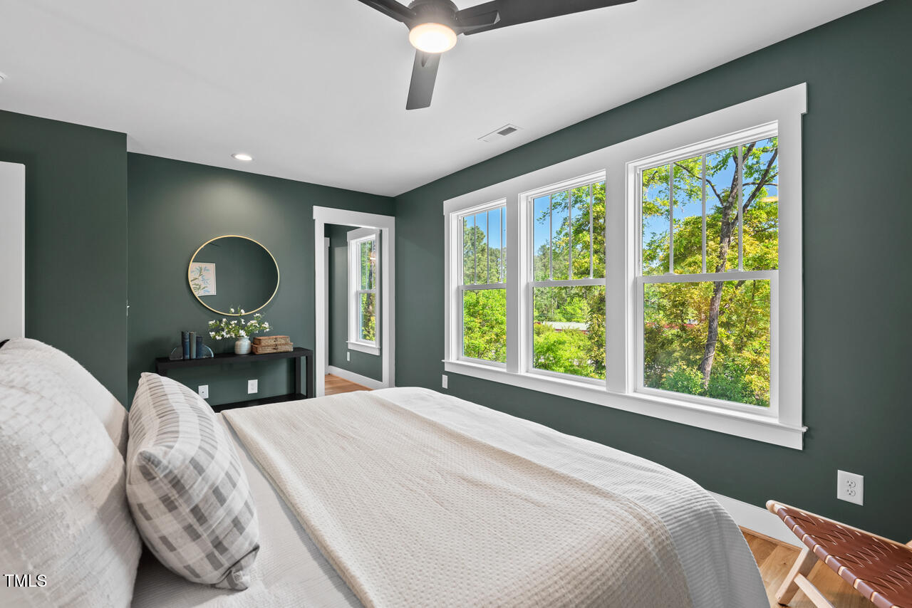 2019 James Street Durham, NC 27707 - Photo 32 of 46 a bedroom with a large bed and a large window