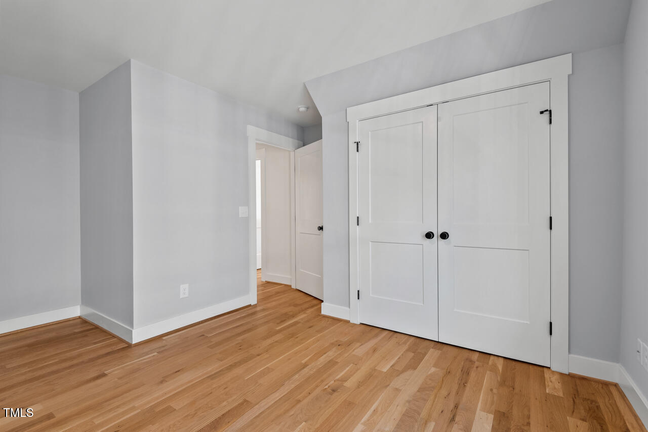 2019 James Street Durham, NC 27707 - Photo 44 of 46 a view of an empty room with wooden floor