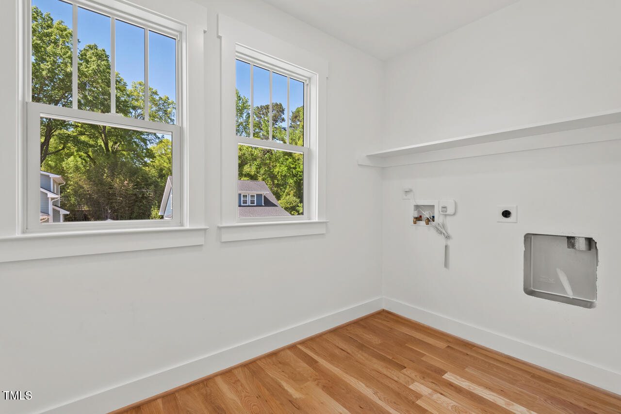 2019 James Street Durham, NC 27707 - Photo 45 of 46 a view of room with window and hardwood floor