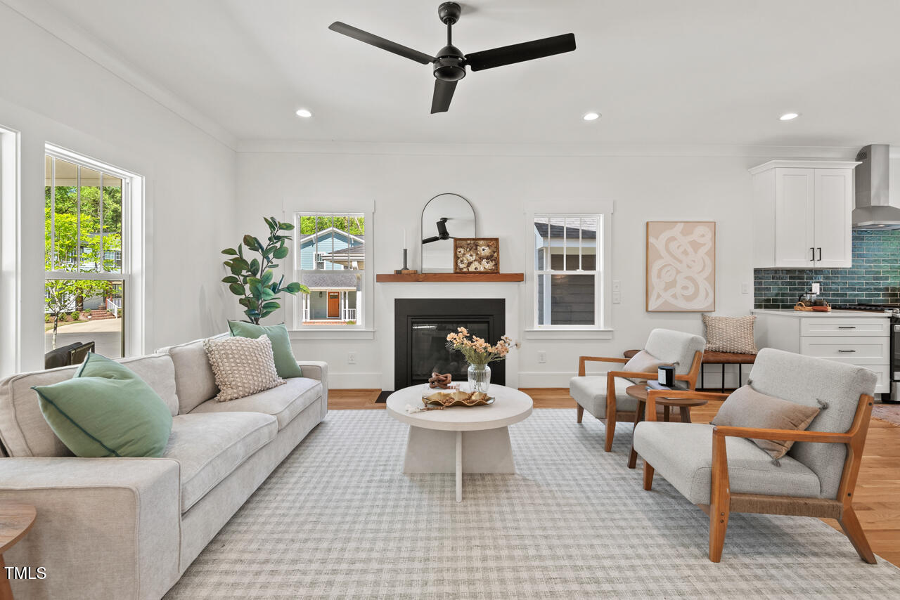 2019 James Street Durham, NC 27707 - Photo 7 of 46 a living room with furniture a window and a fireplace