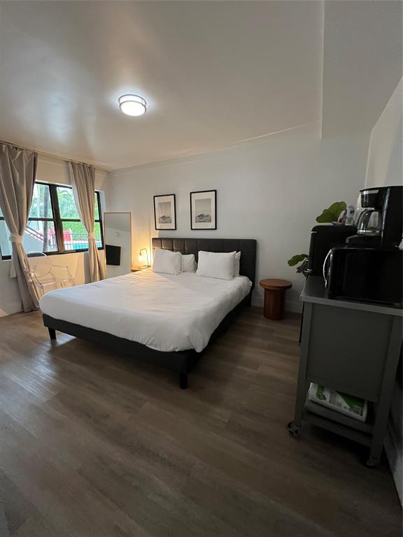 2100 Northeast 33rd Avenue, Unit GS A Fort Lauderdale, FL 33305 - Photo 4 of 12 a bedroom with a bed and a window