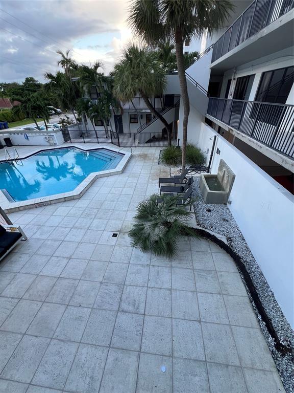 2100 Northeast 33rd Avenue, Unit GS A Fort Lauderdale, FL 33305 - Photo 10 of 12 a view of a terrace with a sitting area