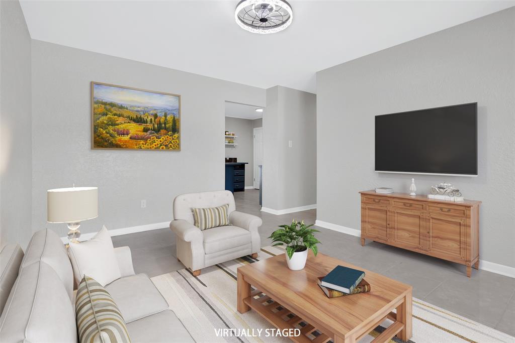 a living room with furniture and a flat screen tv
