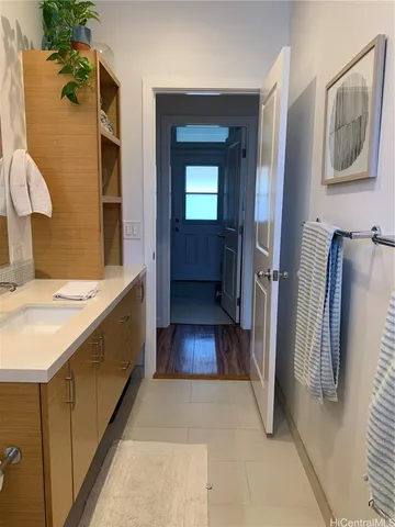 a bathroom with a sink and mirror
