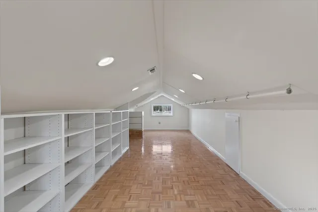 a view of an empty room with closet