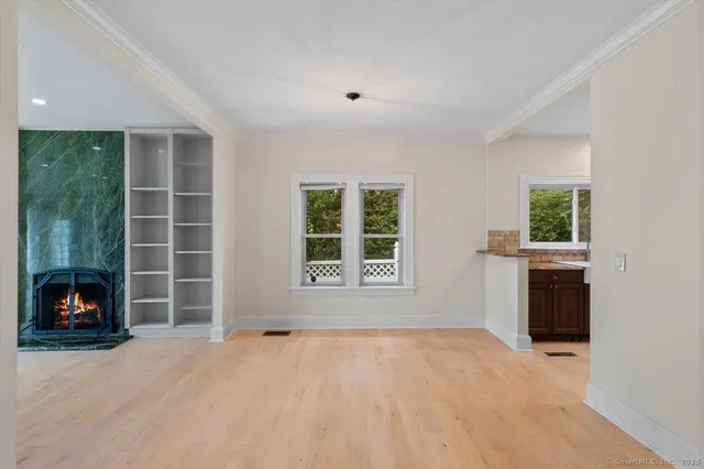 a kitchen with granite countertop a sink and a refrigerator