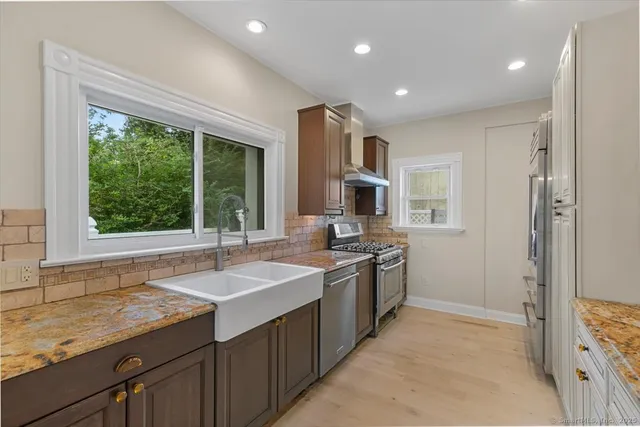 an empty room with a bathroom and sink